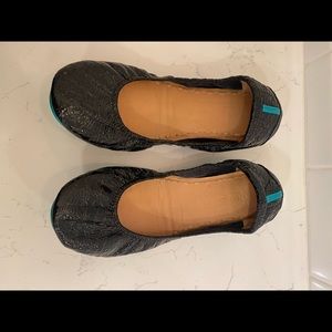 Gently worn, shiny black Tieks